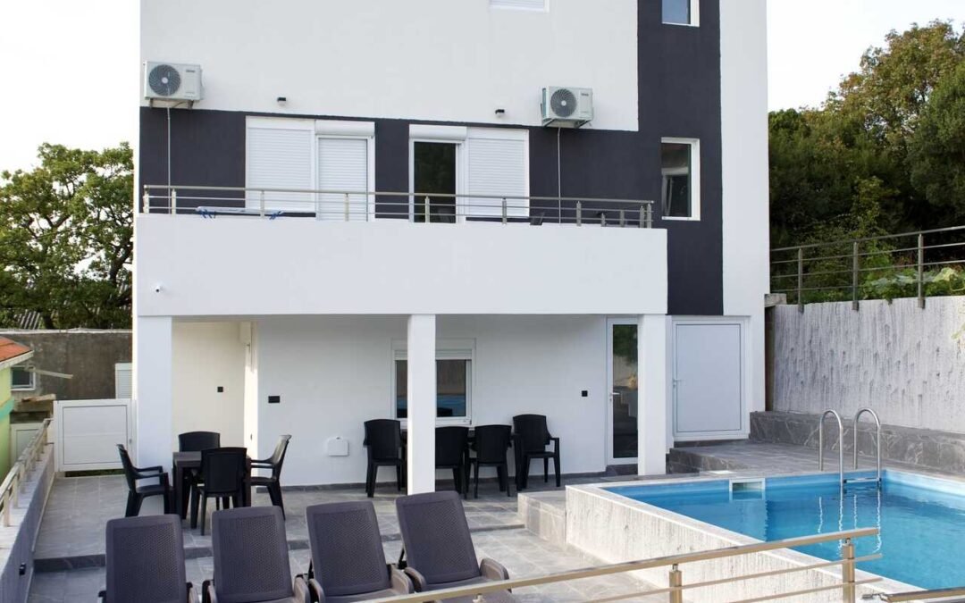 Conversion of a house into a three-storey apartment house with swimming pool
